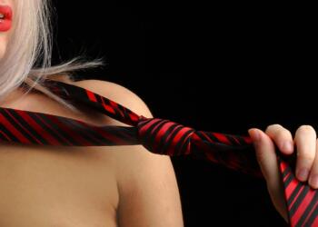 Woman Holding Necktie