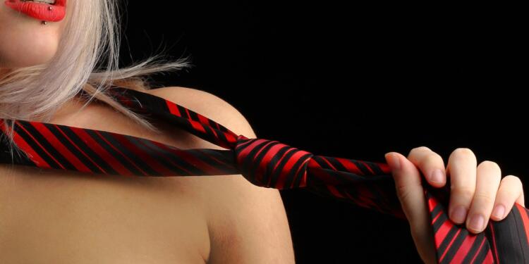 Woman Holding Necktie