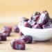 brown round fruit on white ceramic bowl