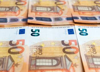 50 euro bill on brown wooden table