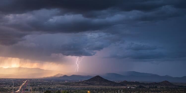 green grass field under cloudy sky during daytime