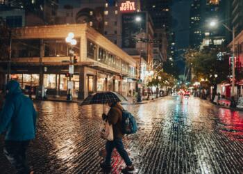A Person with Umbrella Crossing the Street