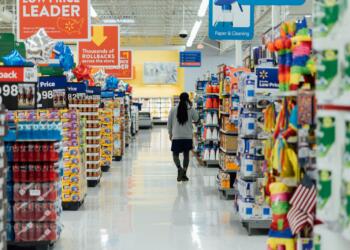 person standing between shelvings