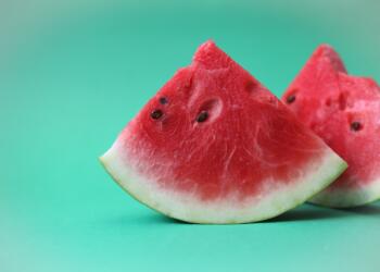sliced watermelon on green surface