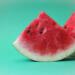 sliced watermelon on green surface