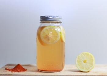 clear glass mason jar on brown surface