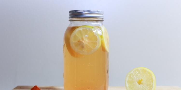 clear glass mason jar on brown surface