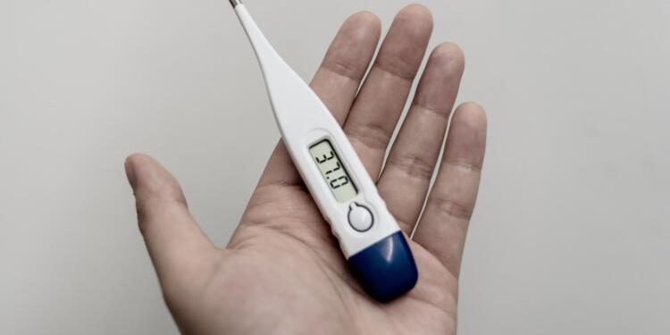 white and blue thermometer at 36 9