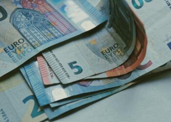 10 euro on brown wooden table