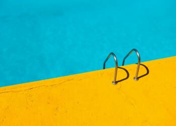 swimming pool with stainless steel ladder