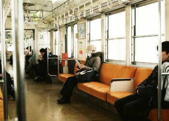 man sitting inside the train