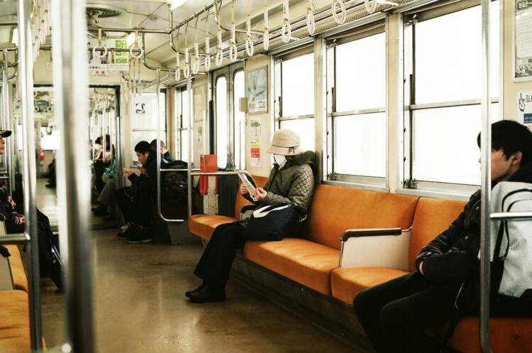 man sitting inside the train
