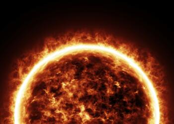 a bright sun is shown in the dark sky