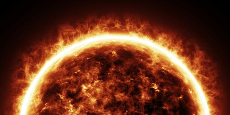 a bright sun is shown in the dark sky