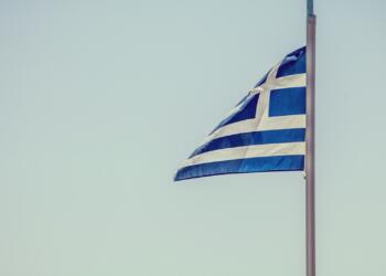 blue and white striped flag on pole