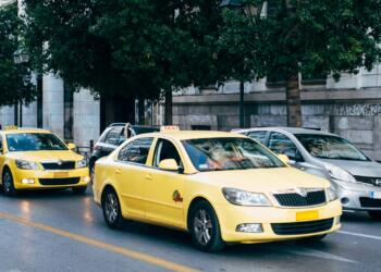 yellow taxi cab on the street