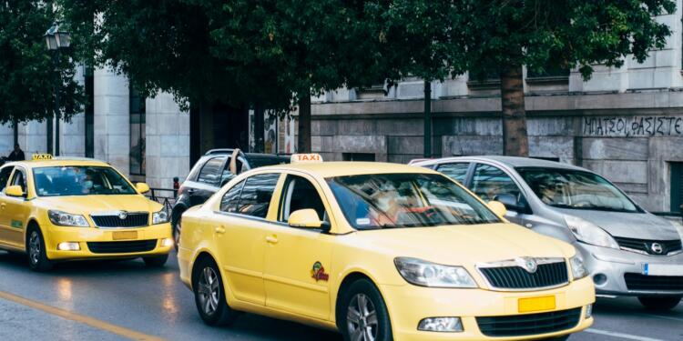 yellow taxi cab on the street